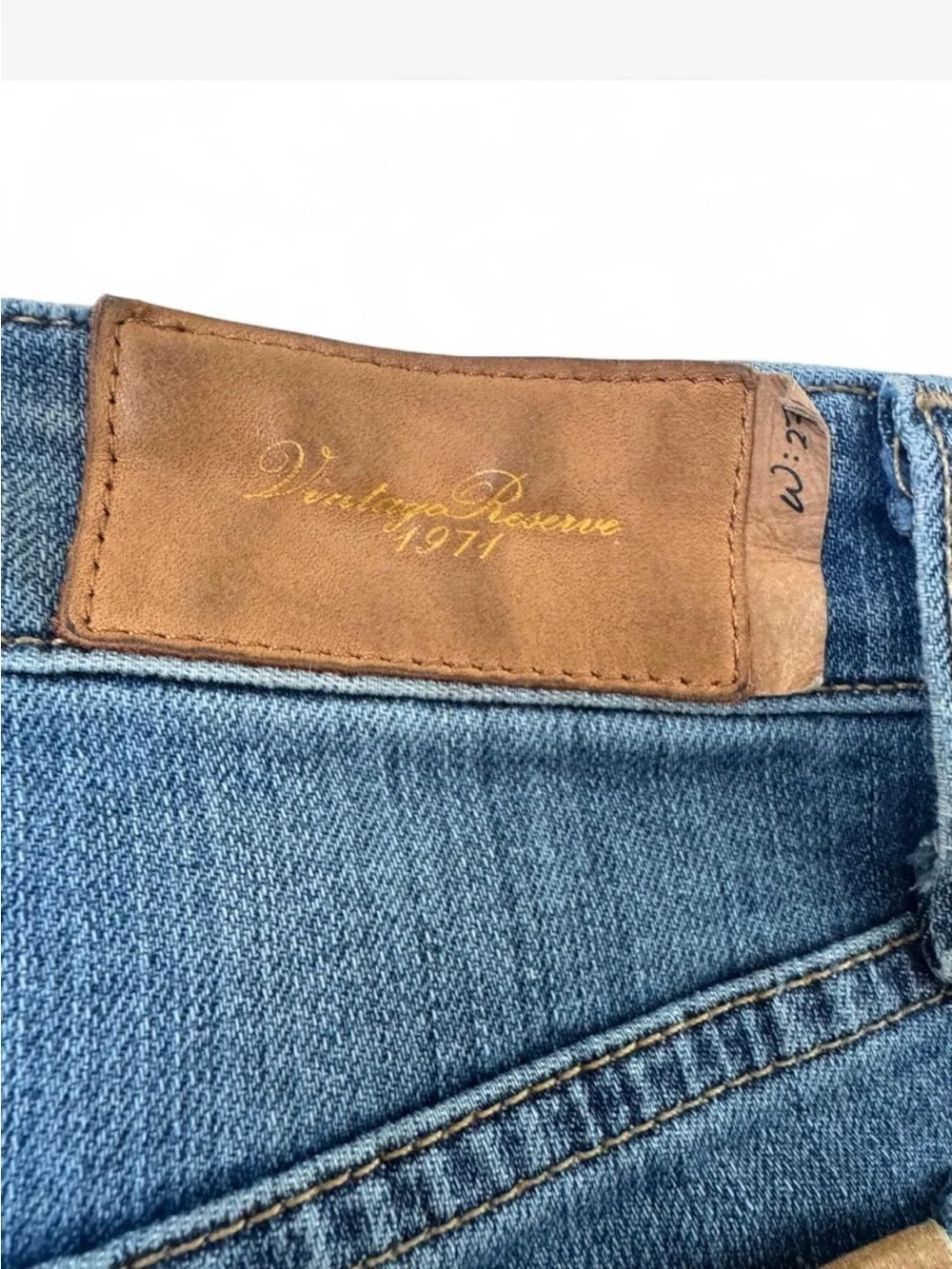 Joe’s Jeans Vintage Reserve 1971 denim shorts in a mid blue wash.